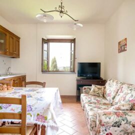 agriturismo-isola-verde-apartment-11-dining-table-sofa-window