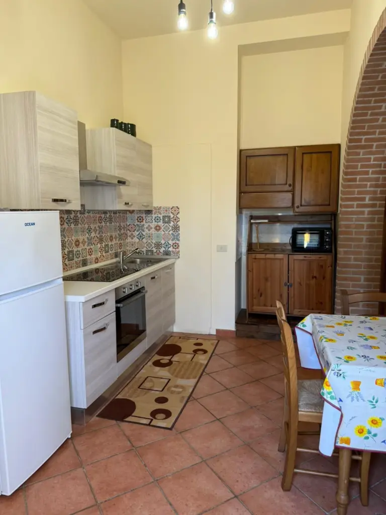 Cucina e zona pranzo dell'Appartamento 13 Basic